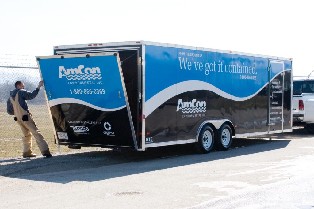 Box trailer with AmCon logo and graphics on sides