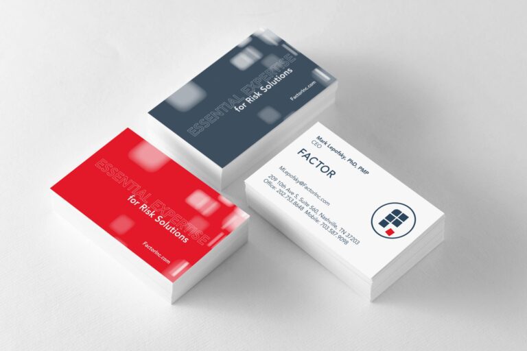 Factor business cards in three stacks, two showing the back sides and on showing the front.