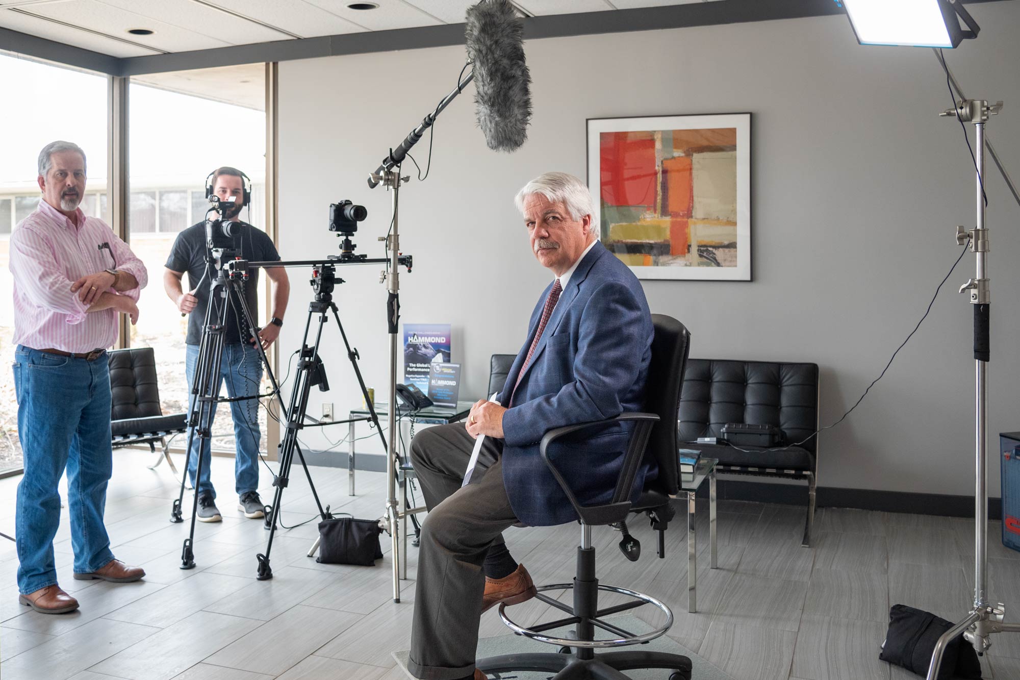 Man being interviewed by camera crew.