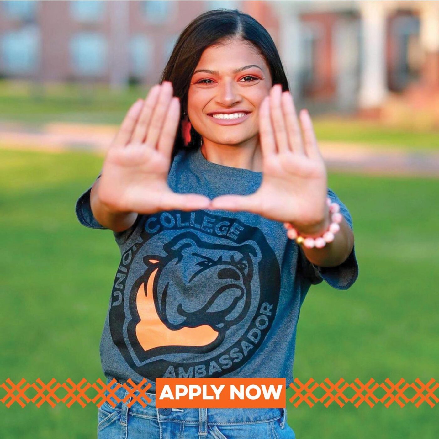 smiling girl wearing Union College branded t-shirt with text that says "apply now"