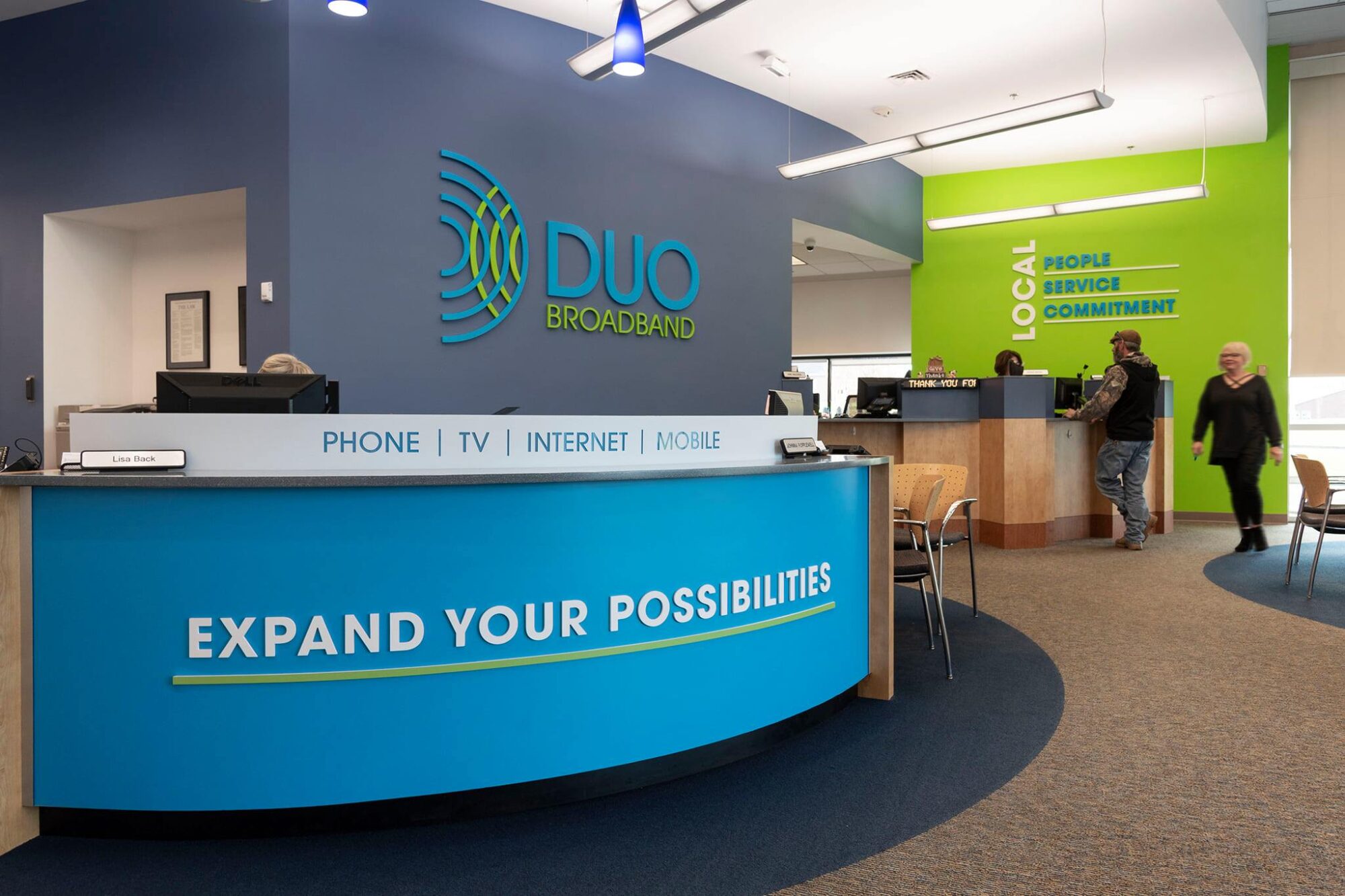 DUO Broadband lobby with brand signage and colorful walls