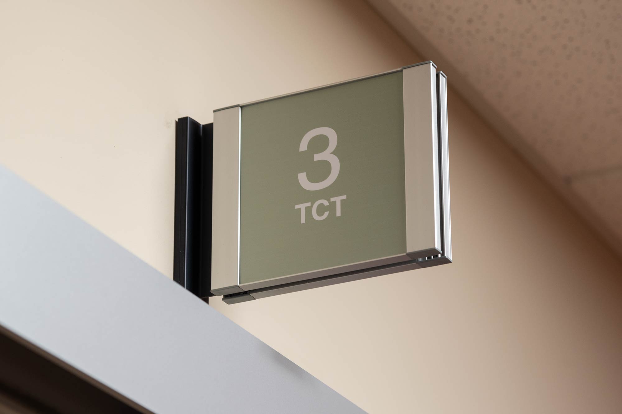 Room number sign above a door