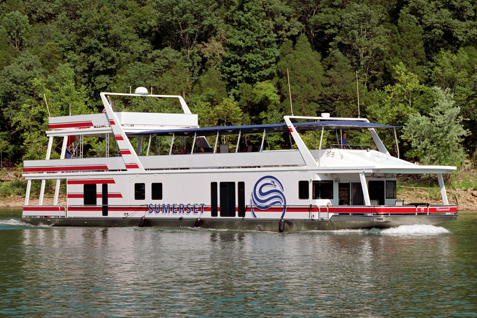 large Houseboat cruising on a lake