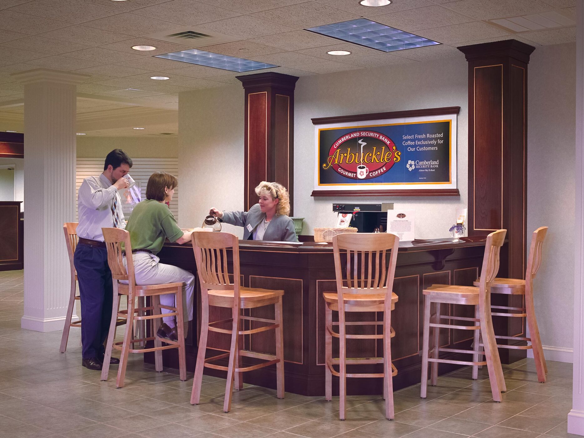 Cumberland Security Bank coffee bar with "Arbuckle's" coffee poster on the wall