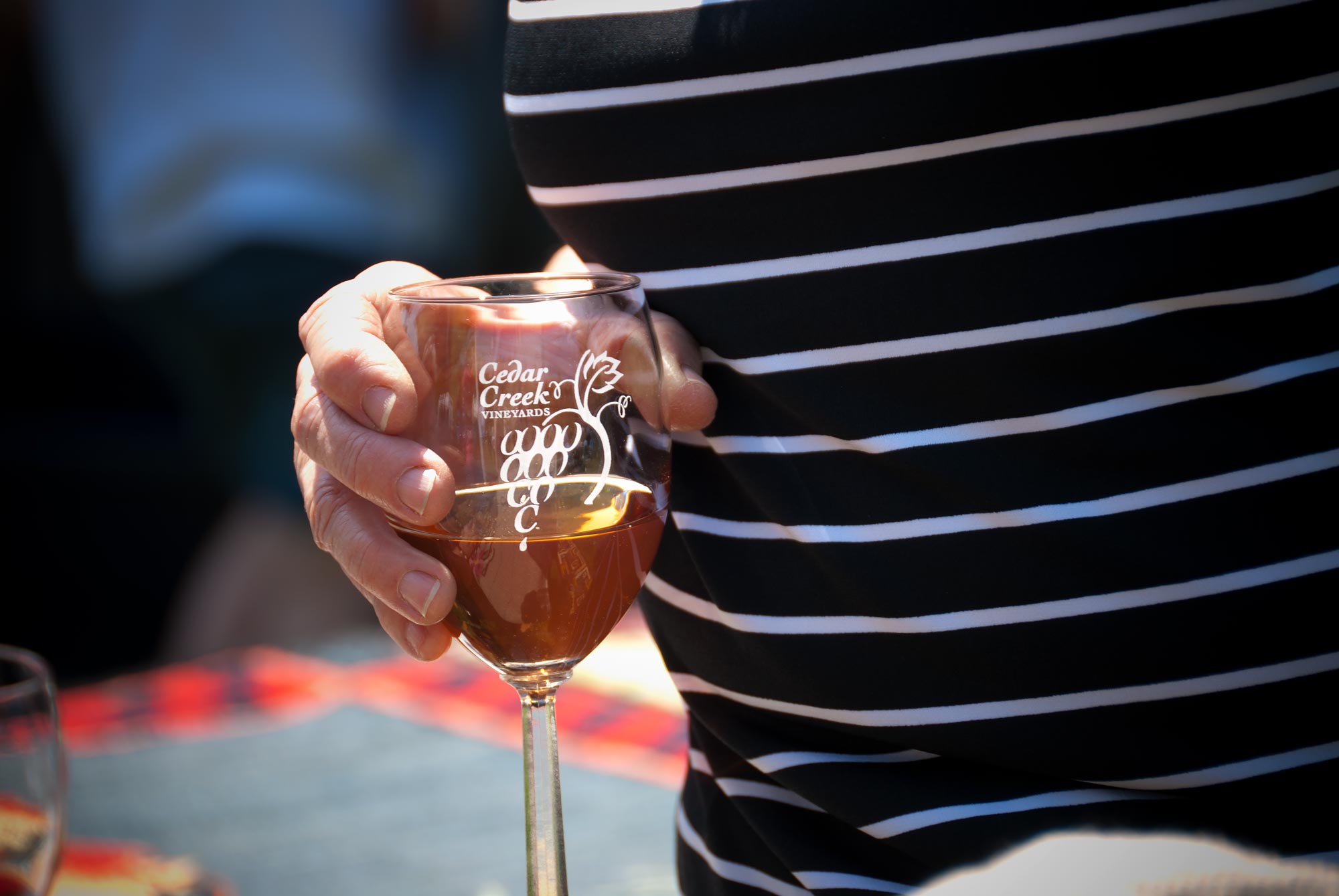 Cedar Creek vineyards ogo on a wine glass