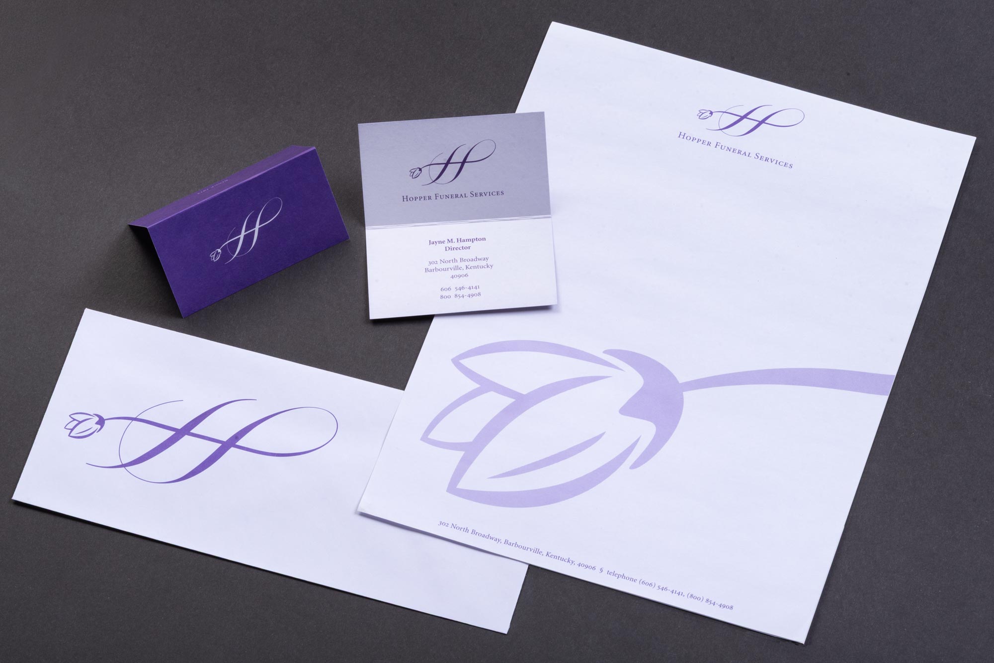 Hopper Funeral Services stationery with flower "H" symbol logo