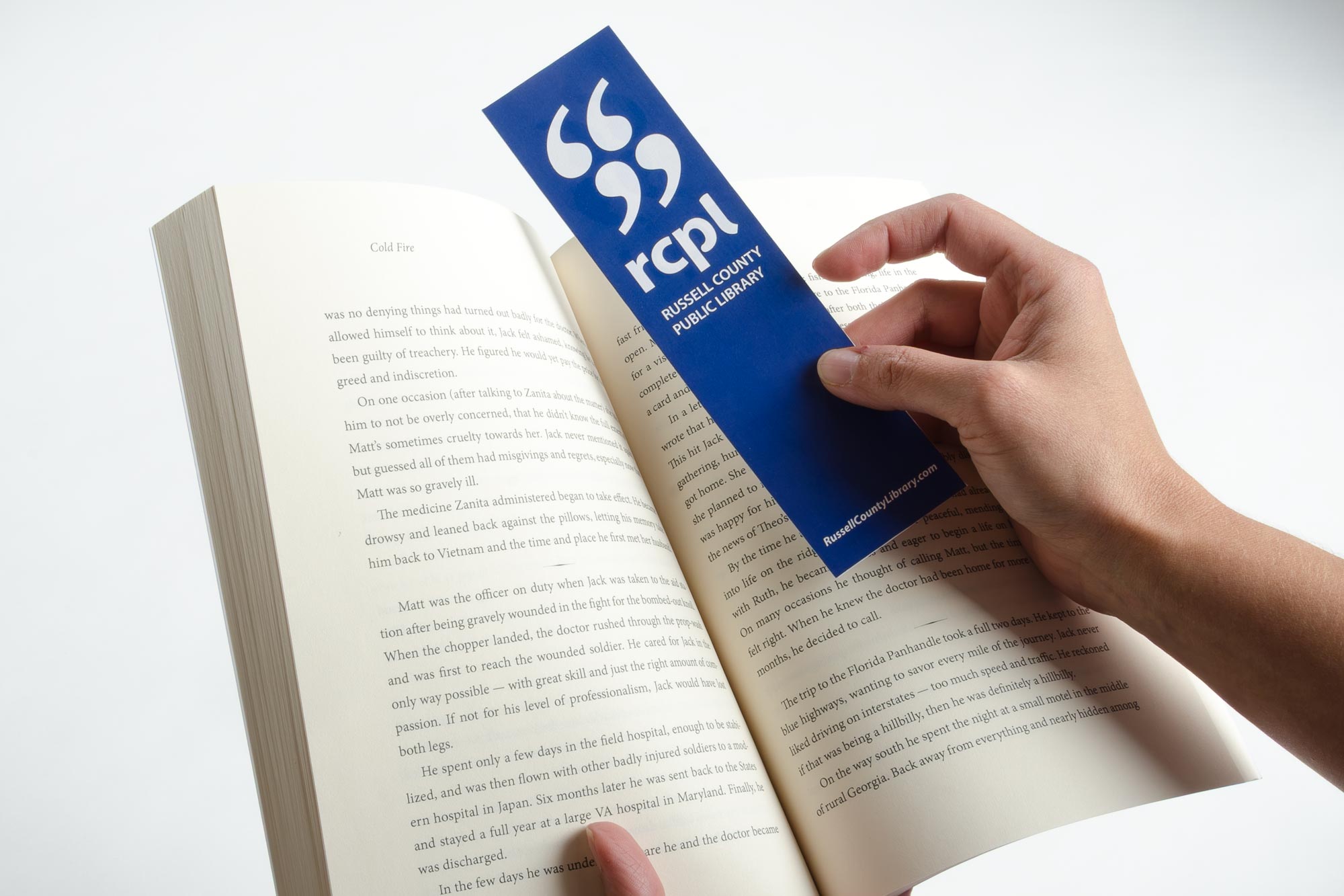 Russell County Public Library hand holding a bookmark