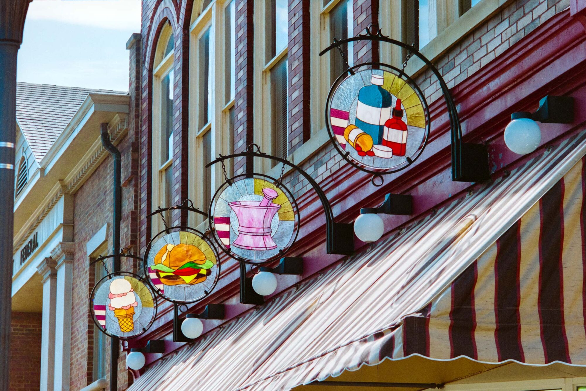 Somerset Pharmacy stained glass street signage
