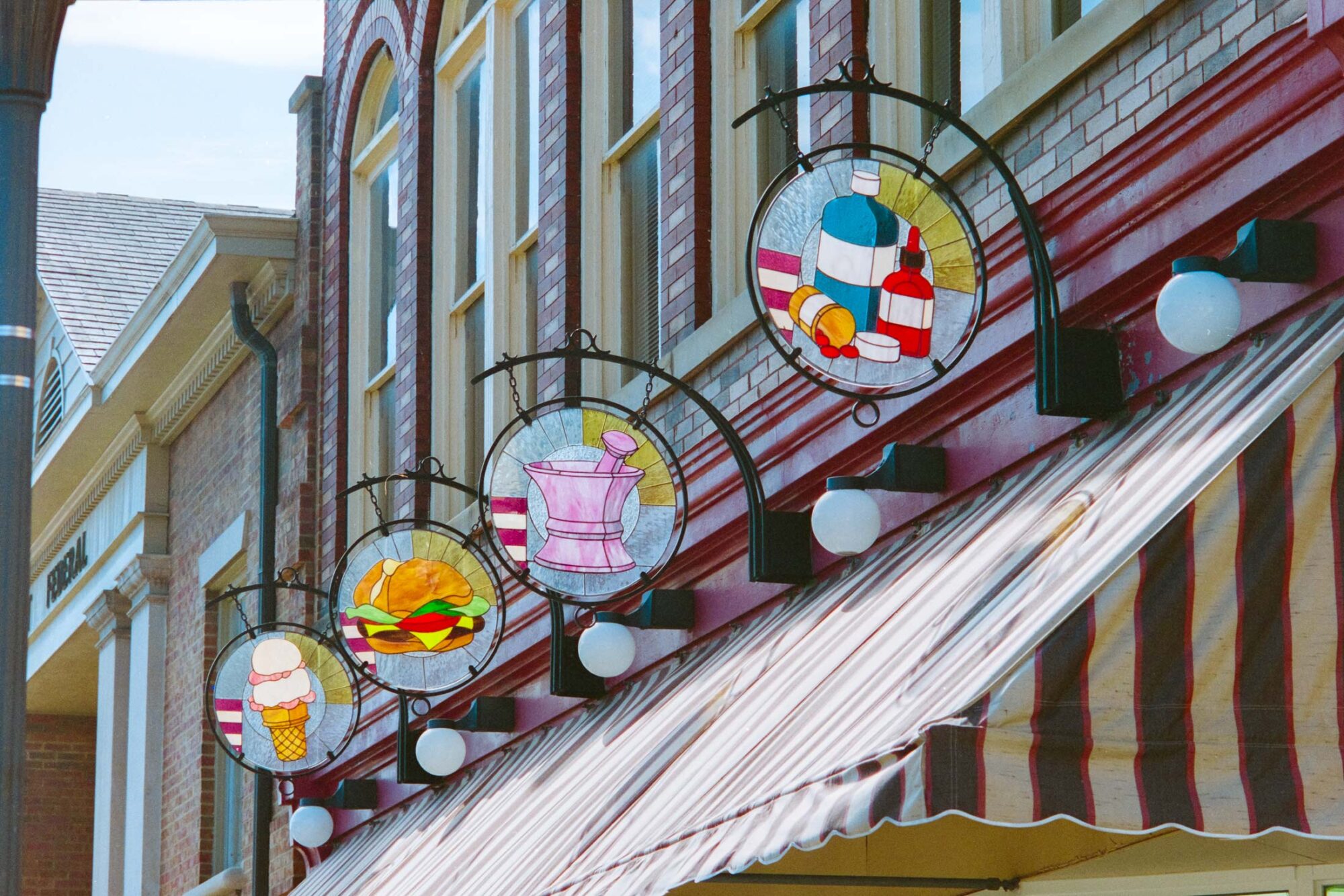 Somerset Pharmacy stained glass street signage