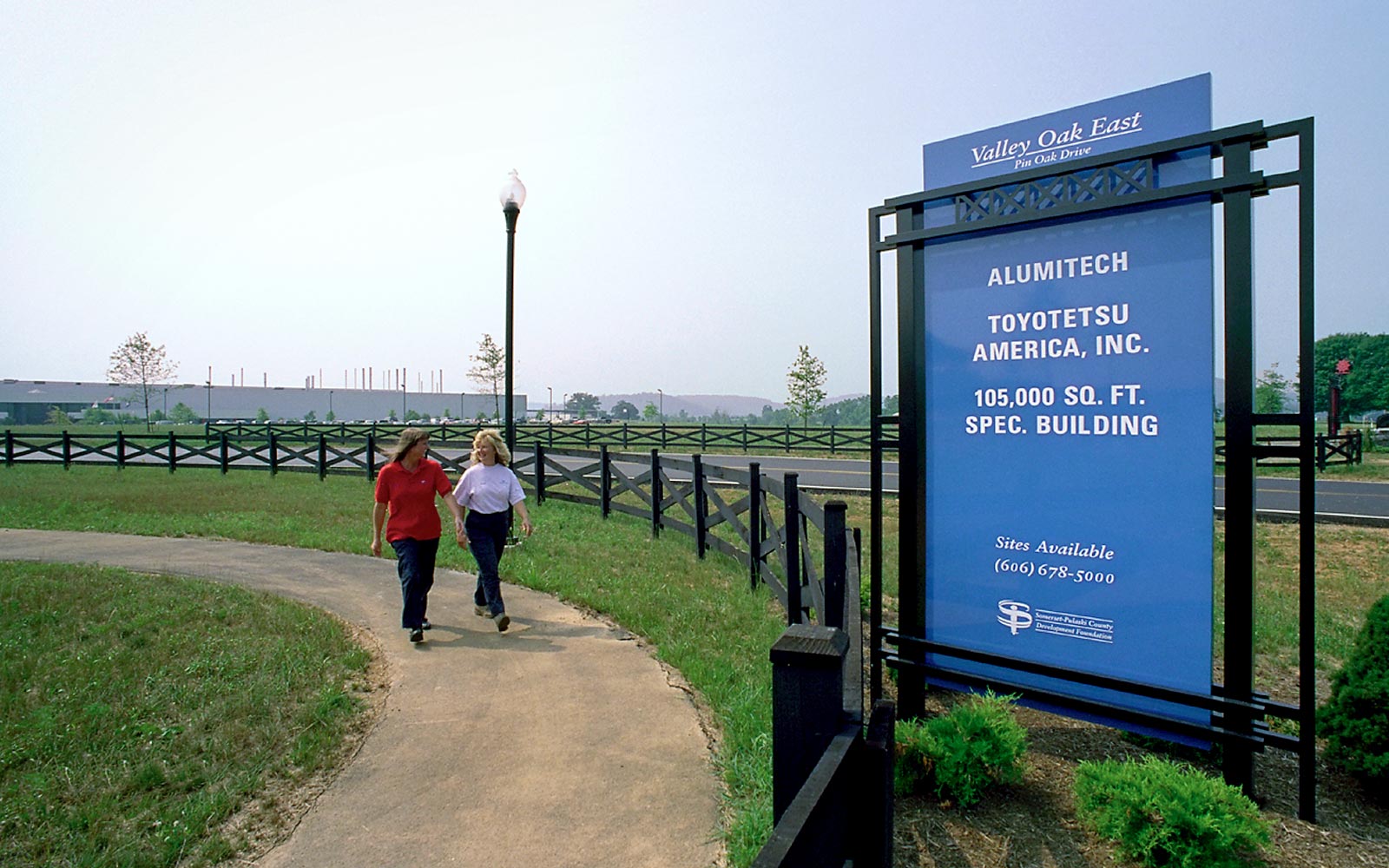Valley Oak Commerce Complex sign by walking path