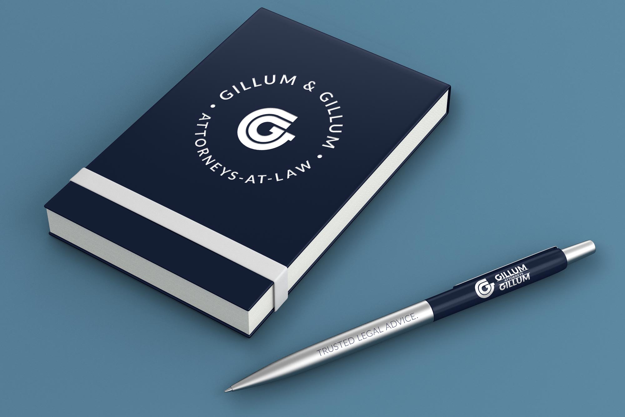 note pad and pen with Gillum & Gillum Attorneys at Law logo applieid