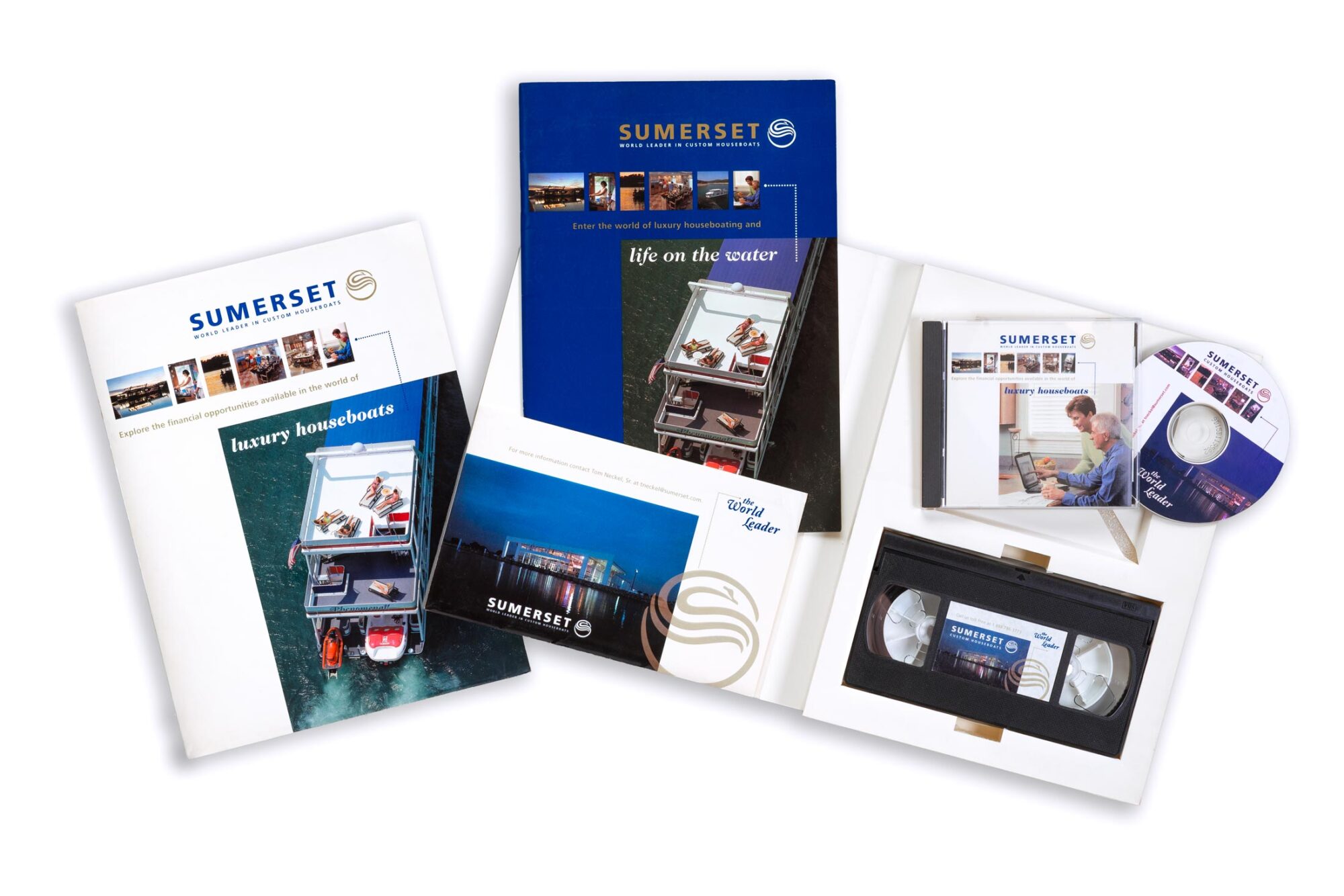 Sumerset Custom Houseboats branded annual report package including brochure, media CD, and VHS video tape.