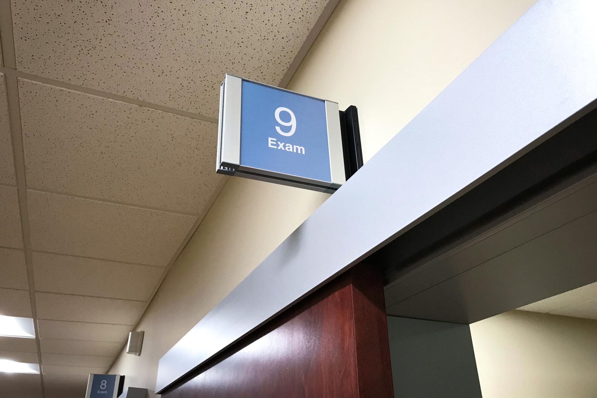 VA clinic above door exam room sign